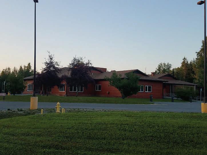 building with green lawn